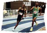 Charlie Allie (l) takes the lead from Frank Sowerby in the 1999 M50 400 with about 150 meters left to win in 53.18, with Sowerby close at 53.45. Photo by Jerry Wojcik, National Masters News