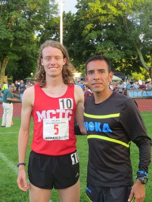 Garrett O'Toole with Olympian and 2014 USA Champion Leo Manzano after the Adrian Martinez Mile. (photo by Chris Lotsbom)